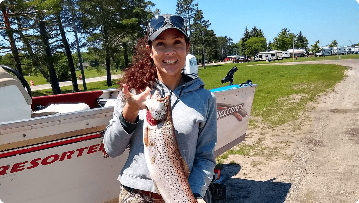 Fisherwoman displaying her catch proudly