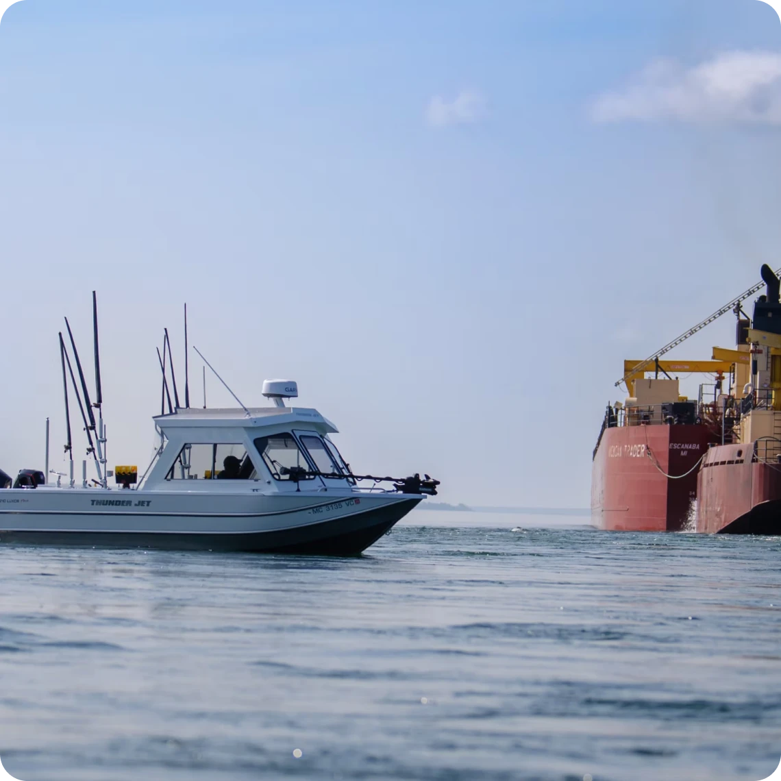 Vessel and ship on the ocean horizon